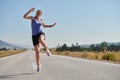 Leap of Victory: Athlete Symbolizes Success and Dedication Through Mid-Air Jump. Royalty Free Stock Photo