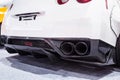 Powerful double exhaust pipe of a white sports car Royalty Free Stock Photo