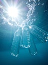 Underwater view of floating plastic bottles and pollution Ai Generated Royalty Free Stock Photo