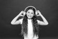 Powerful effect music teenagers their emotions, perception of world. Girl listen music headphones on red background