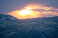 Powerful and explosive sunset with vivid colors over remote mountain road