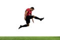 Young football, soccer player of team in action, motion isolated on white background. Concept of sport, movement, energy Royalty Free Stock Photo