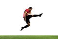 Young football, soccer player of team in action, motion isolated on white background. Concept of sport, movement, energy Royalty Free Stock Photo