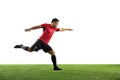 Young football, soccer player of team in action, motion isolated on white background. Concept of sport, movement, energy Royalty Free Stock Photo