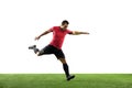 Young football, soccer player of team in action, motion isolated on white background. Concept of sport, movement, energy Royalty Free Stock Photo