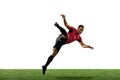 Young football, soccer player of team in action, motion isolated on white background. Concept of sport, movement, energy Royalty Free Stock Photo