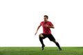 Young football, soccer player of team in action, motion isolated on white background. Concept of sport, movement, energy Royalty Free Stock Photo