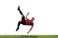 Young football, soccer player of team in action, motion isolated on white background. Concept of sport, movement, energy Royalty Free Stock Photo