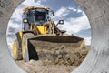 Powerful front wheel loader or bulldozer working on a quarry or construction site. earthworks in construction. Powerful modern Royalty Free Stock Photo