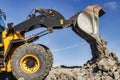 Powerful front wheel loader or bulldozer working on a quarry or construction site. earthworks in construction. Powerful modern Royalty Free Stock Photo