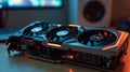 Powerful graphics card with three fans cooling system lying on desk Royalty Free Stock Photo
