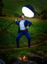 Powerful groom in action hero pose under a light of stroboscope. Royalty Free Stock Photo