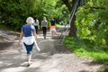 Powerful happy elderly people are walking, running in the park