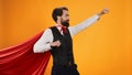 Powerful hero butler posing with cape Royalty Free Stock Photo