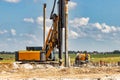 Powerful hydraulic drilling rig at a construction site. The device of pile foundations. Bored piles. Heavy construction equipment