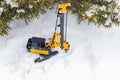Powerful hydraulic drilling rig for the installation of bored piles in the winter in the snow at the construction site. Drilling