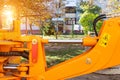 Powerful hydraulic pumps that stand in the bucket of an excavator, industry, close-up, orange Royalty Free Stock Photo