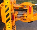 Powerful hydraulic pumps that stand in the bucket of an excavator, industry, close-up, orange, turning Royalty Free Stock Photo