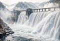 Powerful Hydroelectric Dam and Waterfall Cascade Through Rugged Mountain Landscape - Scenic View Royalty Free Stock Photo