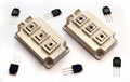 Powerful IGBT transistor modules and small transistors on white Royalty Free Stock Photo