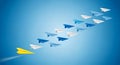 Yellow paper airplane leads the team upwards flying high Royalty Free Stock Photo