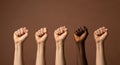 Diverse hands raised in solidarity for equality and justice against racism and discrimination concept Royalty Free Stock Photo
