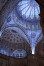 The powerful interior space of the majestic Blue Mosque in Istanbul Royalty Free Stock Photo