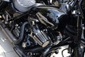 large Harley Davidson motorcycle engine block closeup view. beautiful reflective black paint finish. V engine. Royalty Free Stock Photo