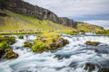 Powerful and magestic waterfall with volcanic rock in an Icelandic landscape2 Royalty Free Stock Photo