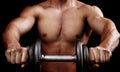 Powerful muscular man holding workout weight Royalty Free Stock Photo