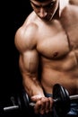 Powerful muscular man lifting weights Royalty Free Stock Photo