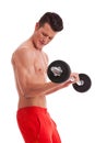 Powerful muscular shirtless man lifting weights Royalty Free Stock Photo