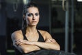 Powerful muscular woman CrossFit trainer doing tire workout at gym Royalty Free Stock Photo