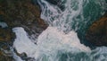 Powerful ocean crashing rocks top view. Beautiful turquoise waves hitting cliffs Royalty Free Stock Photo