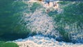 Powerful ocean washing shoreline closeup. Aerial stormy foam waves landscape