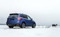 Powerful offroader car view on winter background