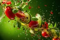 Powerful olive oil explosion, slised cucumber, herbs and tomatos, green Background