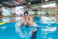 Powerful female swimmer swimming breaststroke at speed