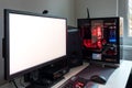 Powerful personal computer gamer rig with white screen. Professsional gaming empty room studio with neon lights and RGB powerful