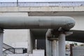 Powerful pipes for supplying heat from a heating station, passing under a road bridge