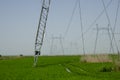 Powerful power line running through cultivated farmland