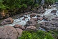 Rushing river flowing through eroded rocks in Tingo Maria Peru Royalty Free Stock Photo