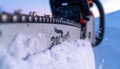 Powerful Chainsaw Slicing Through Fresh Snow Royalty Free Stock Photo