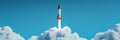 Powerful rocket blasting through white clouds, symbolizing technological advancement, scientific exploration, and human Royalty Free Stock Photo