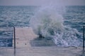 Powerful sea splash wave on the pier Royalty Free Stock Photo