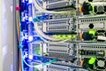 Powerful servers are close-up. A bundle of wires is connected to the computer equipment in the data center server room Royalty Free Stock Photo