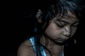 Powerful shot of a sad asian child. Female asian child sad dark scene