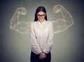 Powerful shy nerdy girl flexing muscles Royalty Free Stock Photo