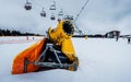 Powerful snow cannon on the background of the ski slope in the resort of Bukovel in Ukraine Royalty Free Stock Photo