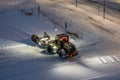 Powerful snowplough clearing parking lot